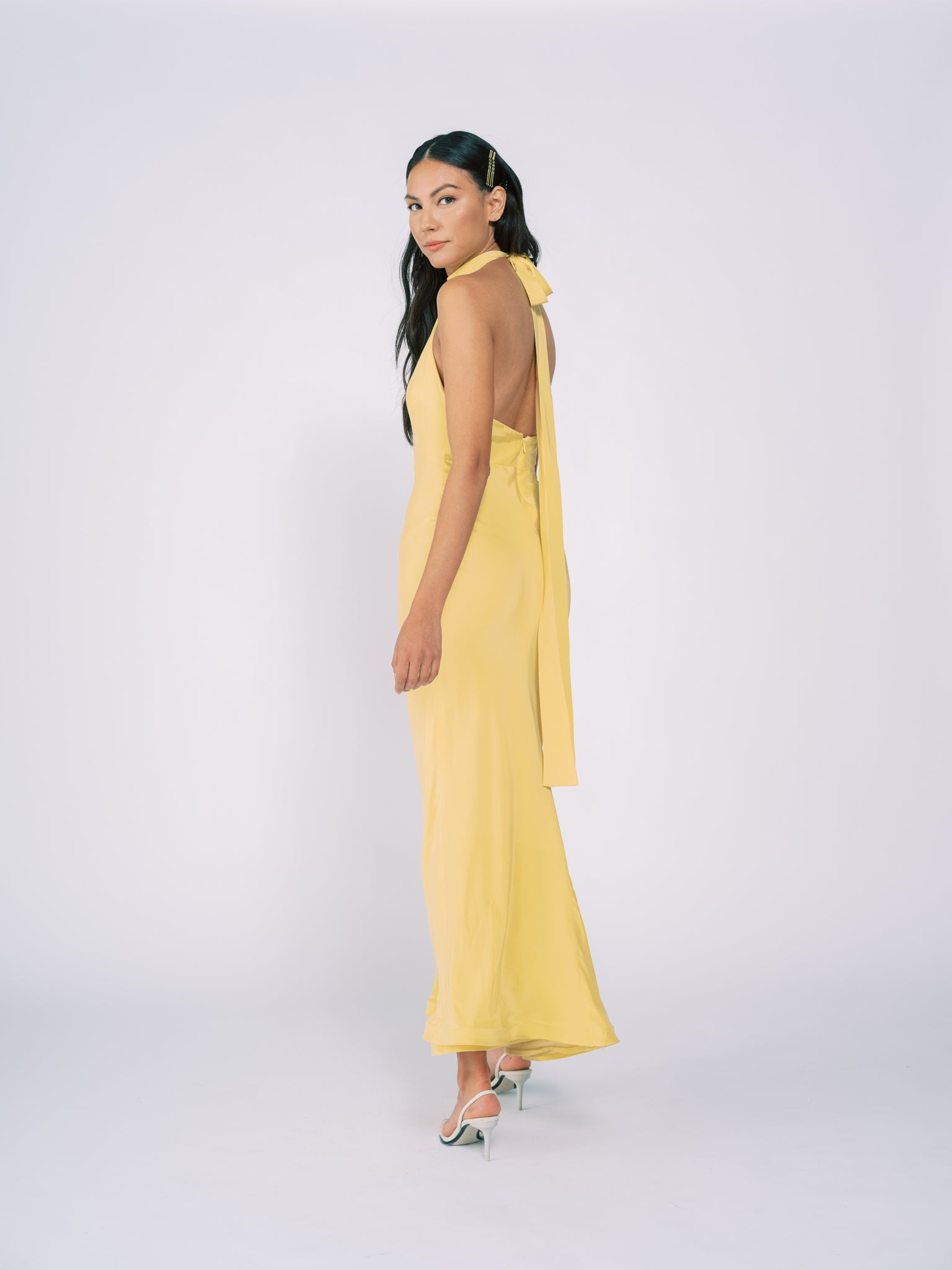 Silk Halter Gown in Pale Yellow by Tanroh Womenswear TANROH Silk Halter Gown in Pale Yellow by Tanroh Womenswear TANROH